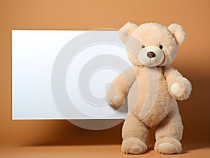 brown teddy bear with a blank sign with space for copy