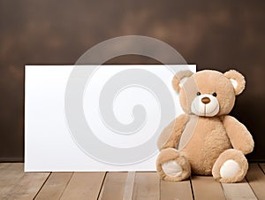 brown teddy bear with a blank sign with space for copy