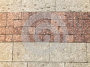 The brown texture of stone granite marble paving slabs. The background