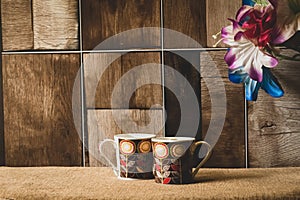 A brown textured background perfectly clicked with selective focus on pair of cups