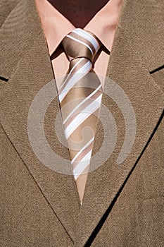 Brown tie and brown suit