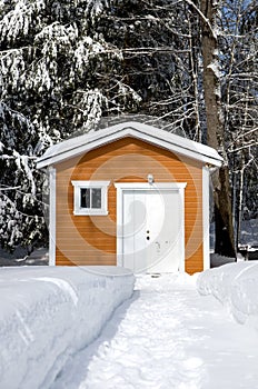 Brown Tool Shed with Fresh Snow on a Cold Winter Day