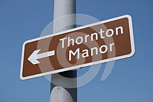 Brown tourist information sign for Thornton Manor Thornton Hough Wirral June 2020