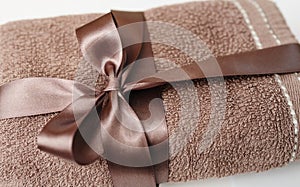 Brown towel tied with a bow