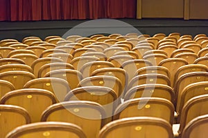 Brown vintage seats armchairs in theater. Theater or conference room interior.