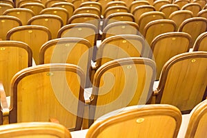 Brown vintage seats armchairs in theater. Theater or conference room interior.