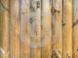 Brown vintage wooden background. The texture of a rough wooden blockhouse