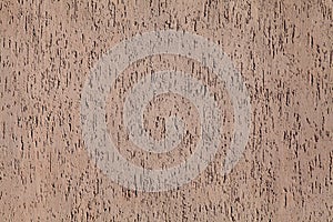 Brown wall, texture, background. Decorated surface with vertical embossed pattern