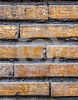 Brown weathered brick wall seamless pattern background with horizontal lines.