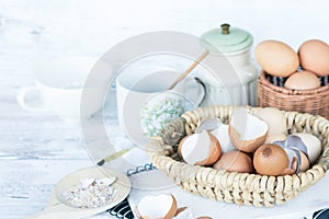 Brown and white eggshells placed in basket in home kitchen on table, eggshells stored for making natural fertilizers for growing v