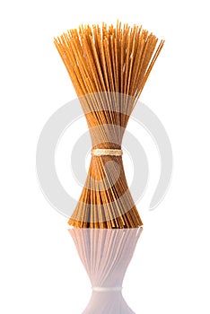 Brown Whole-Wheat Spaghetti Pasta on Isolated White Background