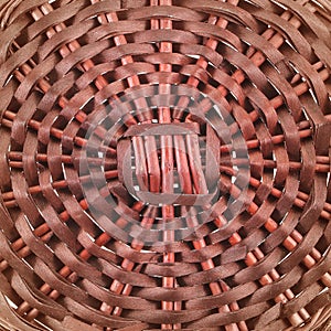 Brown wicker basket top view isolated on white background