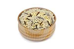 brown and wild rice in a wooden dish