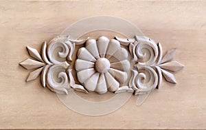 Brown wood carved panel with beautiful floral pattern