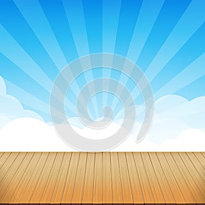 Brown wood floor texture and blue sky sunburst background empty