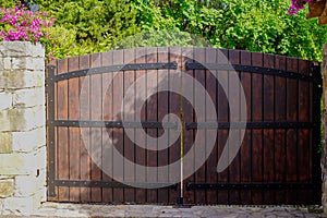 Brown wood portal high natural wooden gate of private house in suburb area