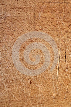 Brown wood texture with scratches. Natural surface of the working space. cracked and friable. macro photo. vertical shot