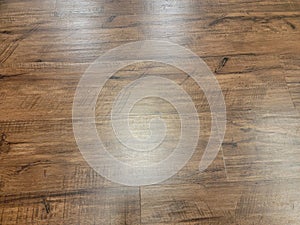 brown wood tiles on floor or ground with light reflection