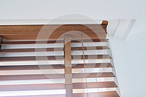 Brown wooden blinds in the interior close-up