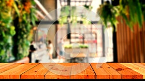 brown wooden board over blurred coffee shop