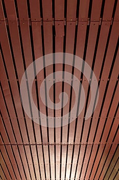 Brown wooden ceiling background with light.