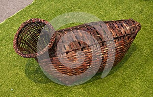 Brown wooden Creel is a wicker basket usually used for carrying fish in Thailand.
