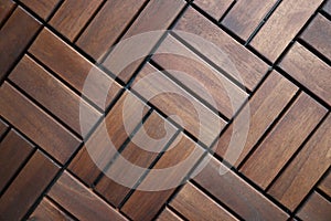 Brown wooden decking tiles. Floor coverings for apartments and houses