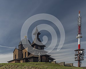 Brown wooden old chapel and transmitter on Radhost hill in Beskydy mountains