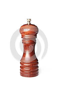 Brown wooden pepper mill on white background