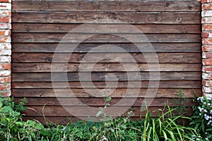 Brown Wooden picket fence frame. rustic background
