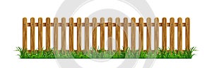 Brown wooden picket fence with green grass