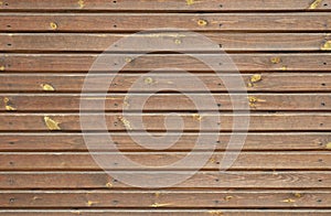 Brown wooden shield of narrow planks.