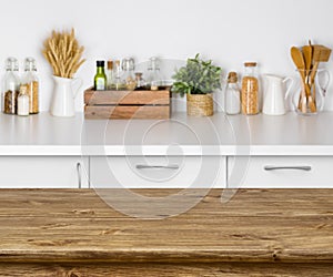 Brown wooden table with bokeh image of kitchen bench interior