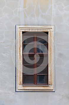 A brown, wooden window.