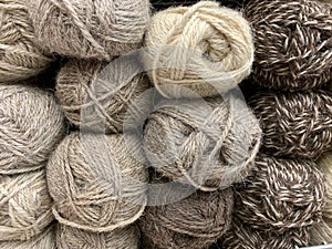 The brown wool of the meats of the yarns lies beautifully in the store.