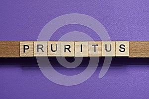 Brown word pruritus in small square wooden letters