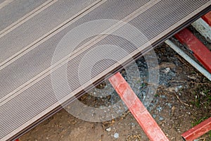 Brown WPC composite deck flooring mounted on steel profile