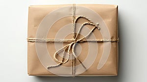 A brown wrapped gift with twine on a white background