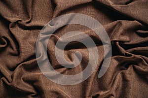 Brown wrinkled fabric texture.