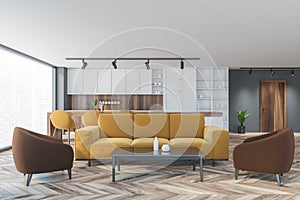 Brown and yellow apartment with sofa and kitchen, furniture on wooden parquet