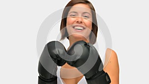 Brownhaired woman with boxing gloves