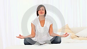 Brownhaired woman doing yoga