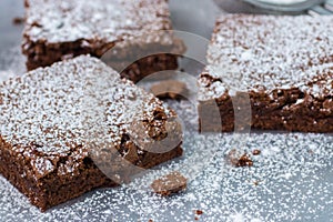 Brownie. Chocolate cakes with powdered sugar