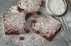 Brownie. Chocolate cakes with powdered sugar