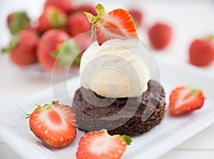 Brownie with ice cream and strawberries