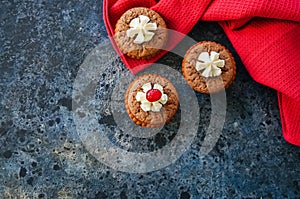 Brownie mins pies on a blue stone background. photo