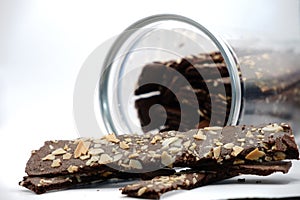 Brownie sticks in jar on white background,brownie sticks with almonds.