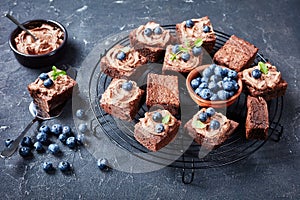 Brownies with berries on a wire stand