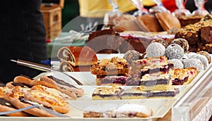 Brownies and other fruit pastry at bakery stand at farmers market