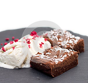 Brownies with vanilla ice-cream isolated on white